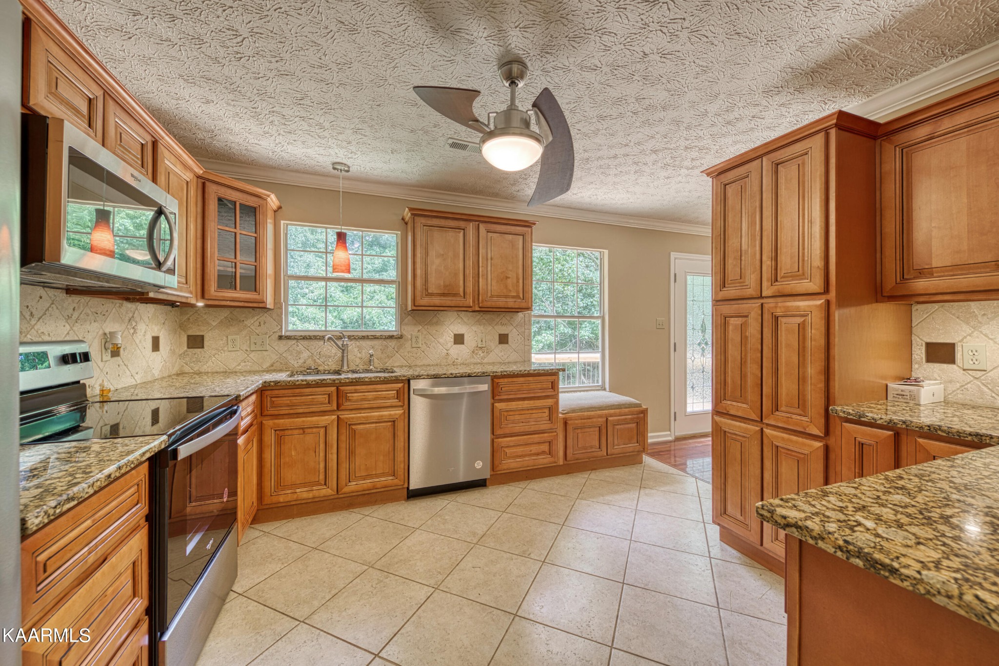 1859 Poplar Hill Road Knoxville, TN 37922 - Photo 11 of 39 a kitchen with stainless steel appliances granite countertop a sink stove and refrigerator