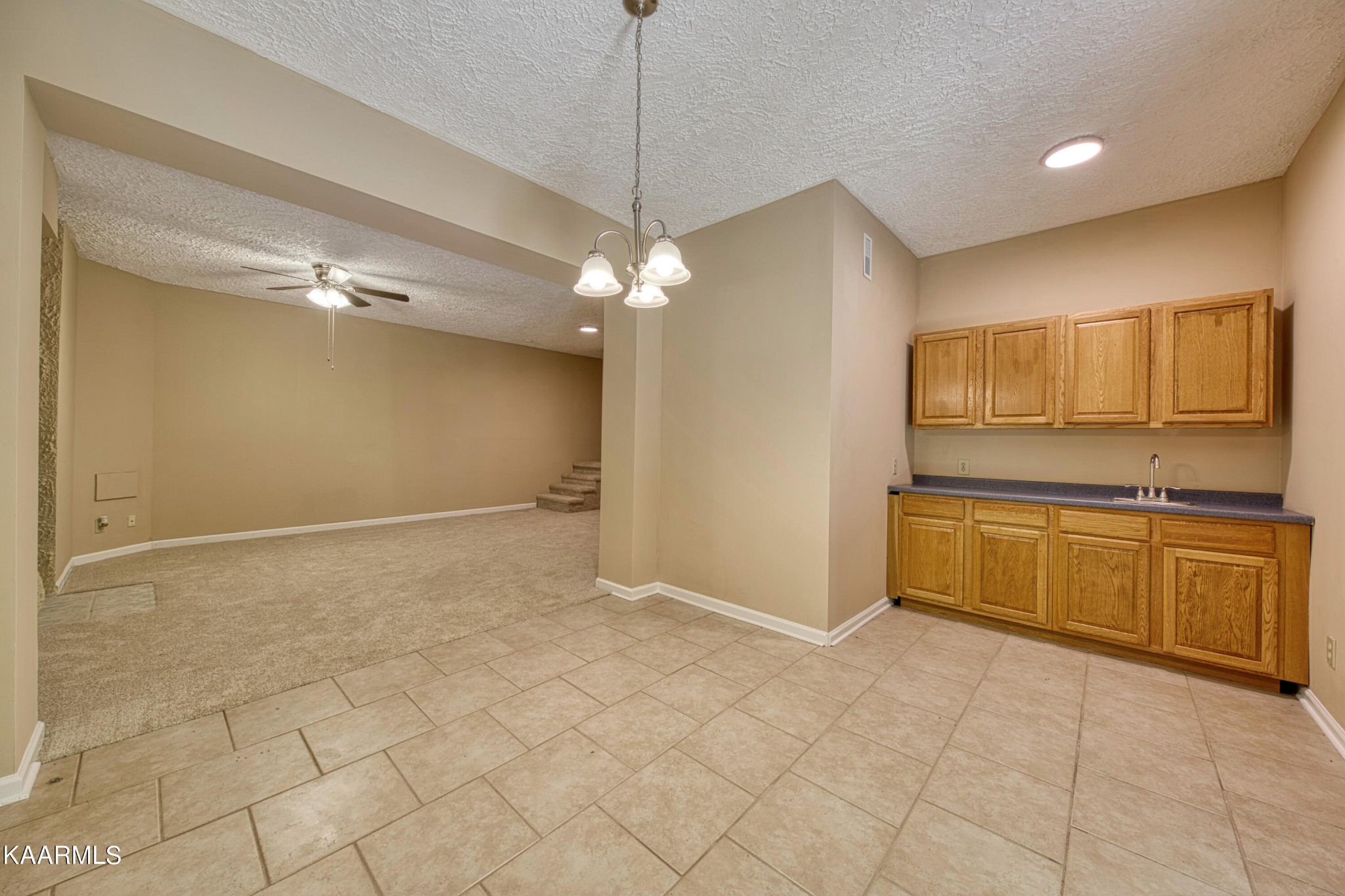 1859 Poplar Hill Road Knoxville, TN 37922 - Photo 18 of 39 a view of a kitchen with a sink and dishwasher a refrigerator with white cabinets