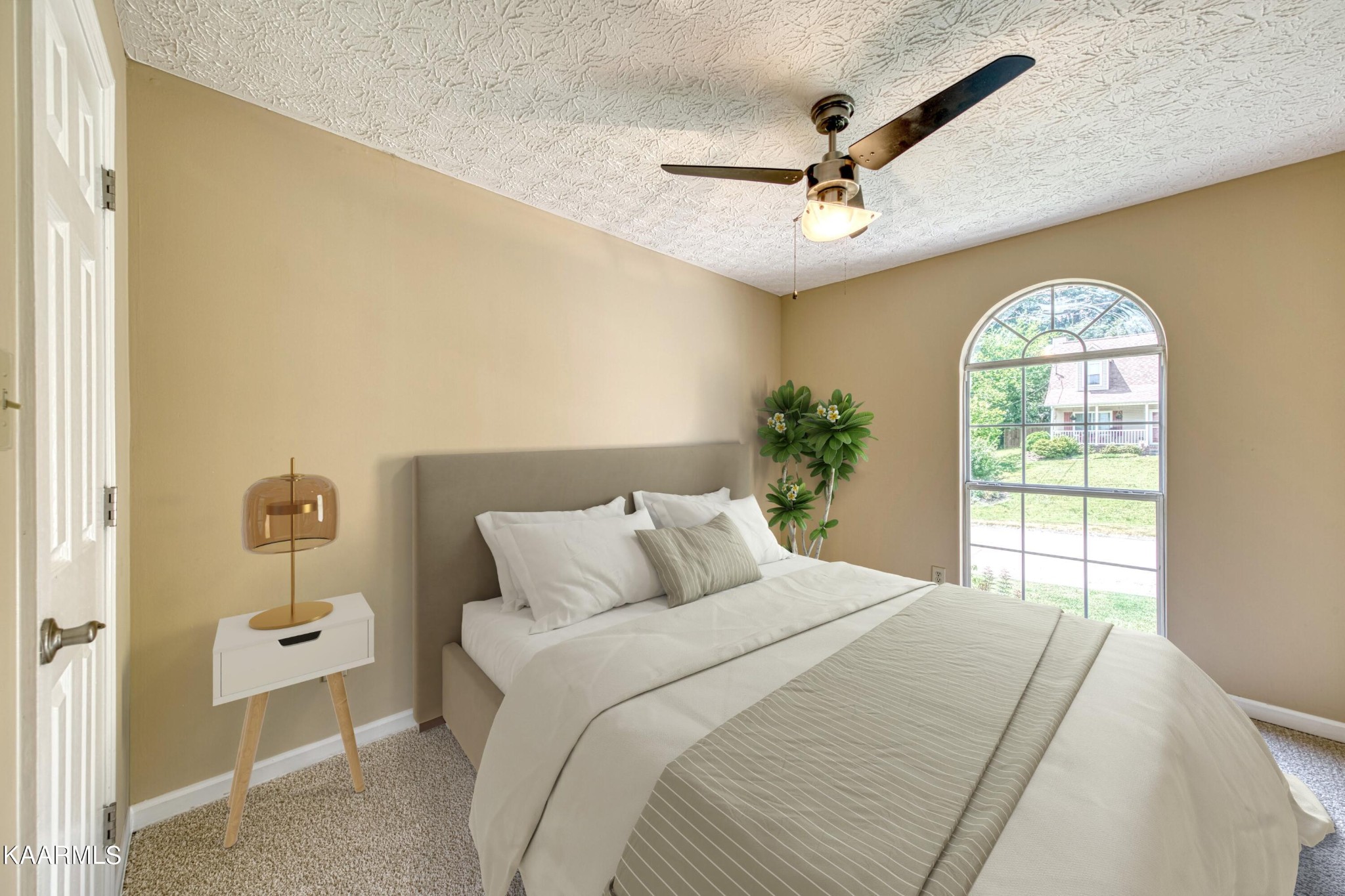 1859 Poplar Hill Road Knoxville, TN 37922 - Photo 28 of 39 a bedroom with a large bed and a chandelier