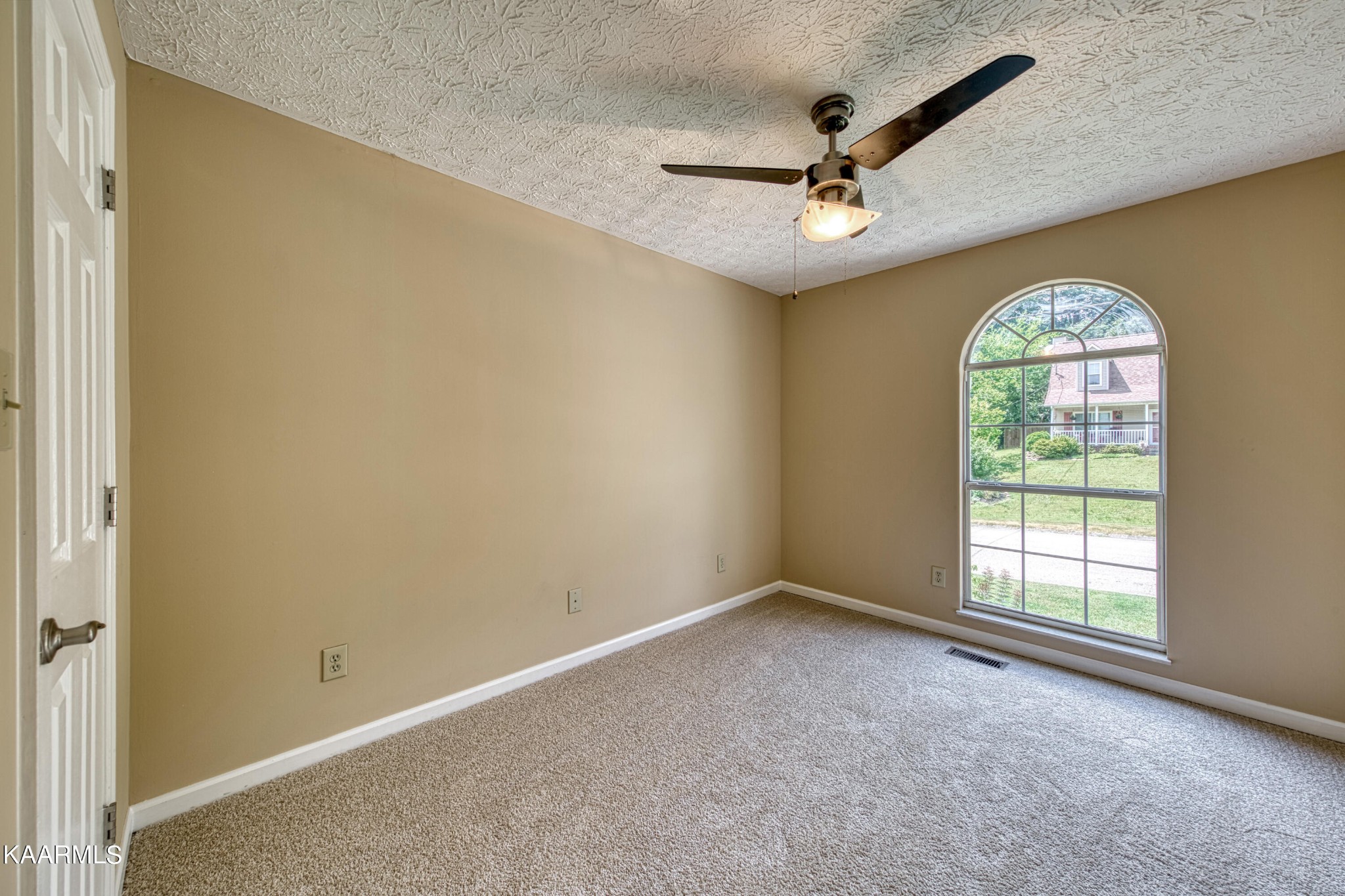 1859 Poplar Hill Road Knoxville, TN 37922 - Photo 30 of 39 an empty room with windows and ceiling fan