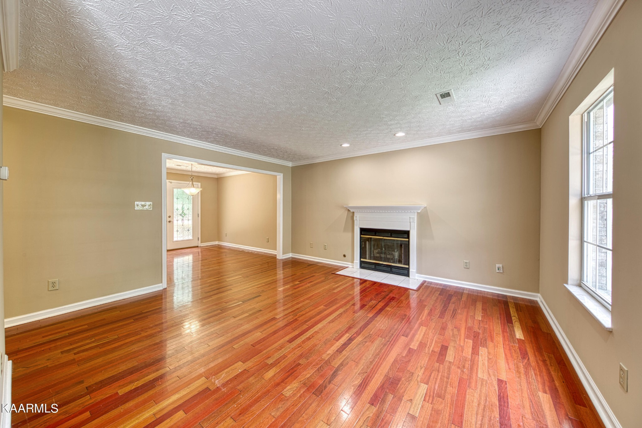 1859 Poplar Hill Road Knoxville, TN 37922 - Photo 3 of 39 wooden floor in an empty room with a window