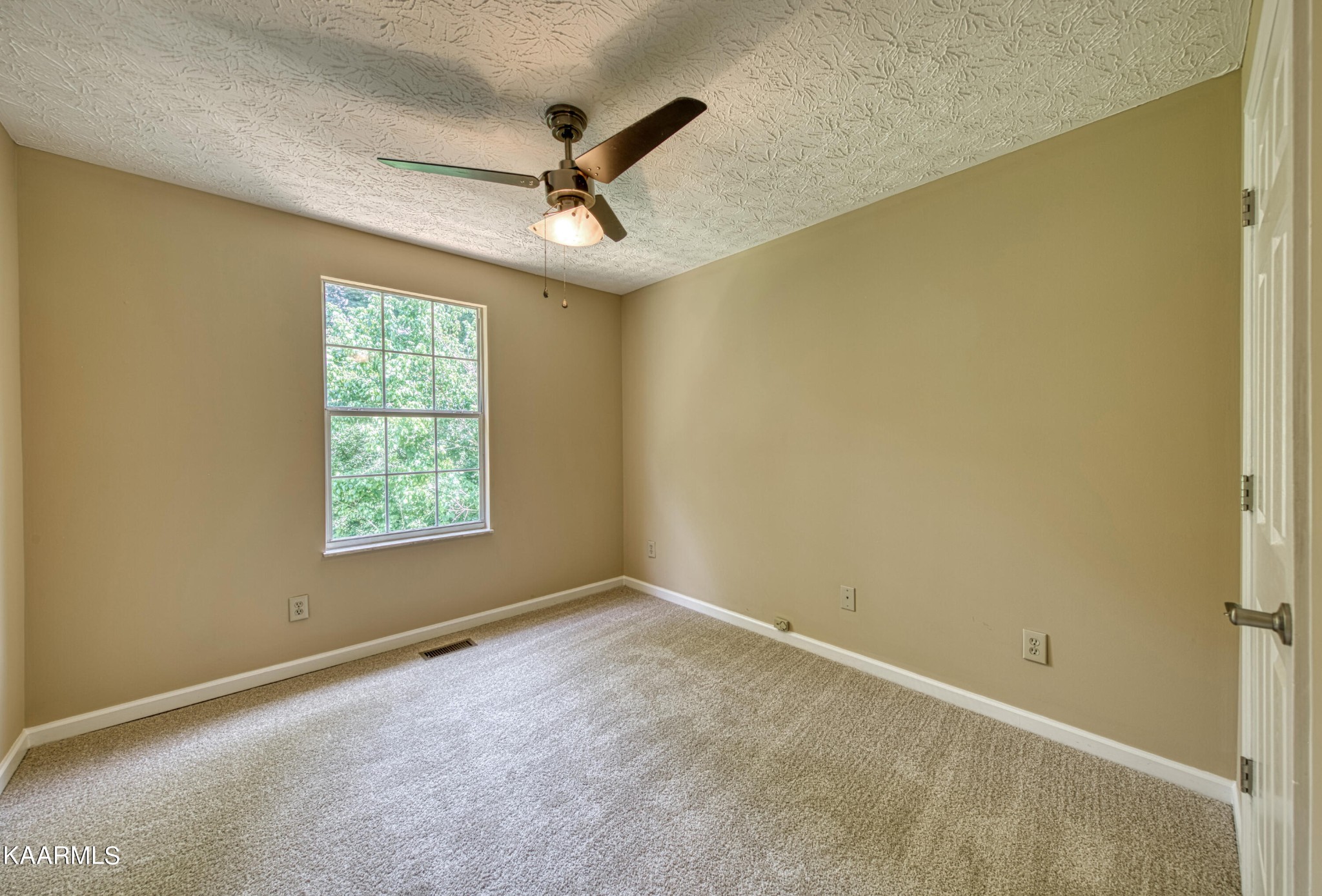 1859 Poplar Hill Road Knoxville, TN 37922 - Photo 32 of 39 an empty room with a window and a fan