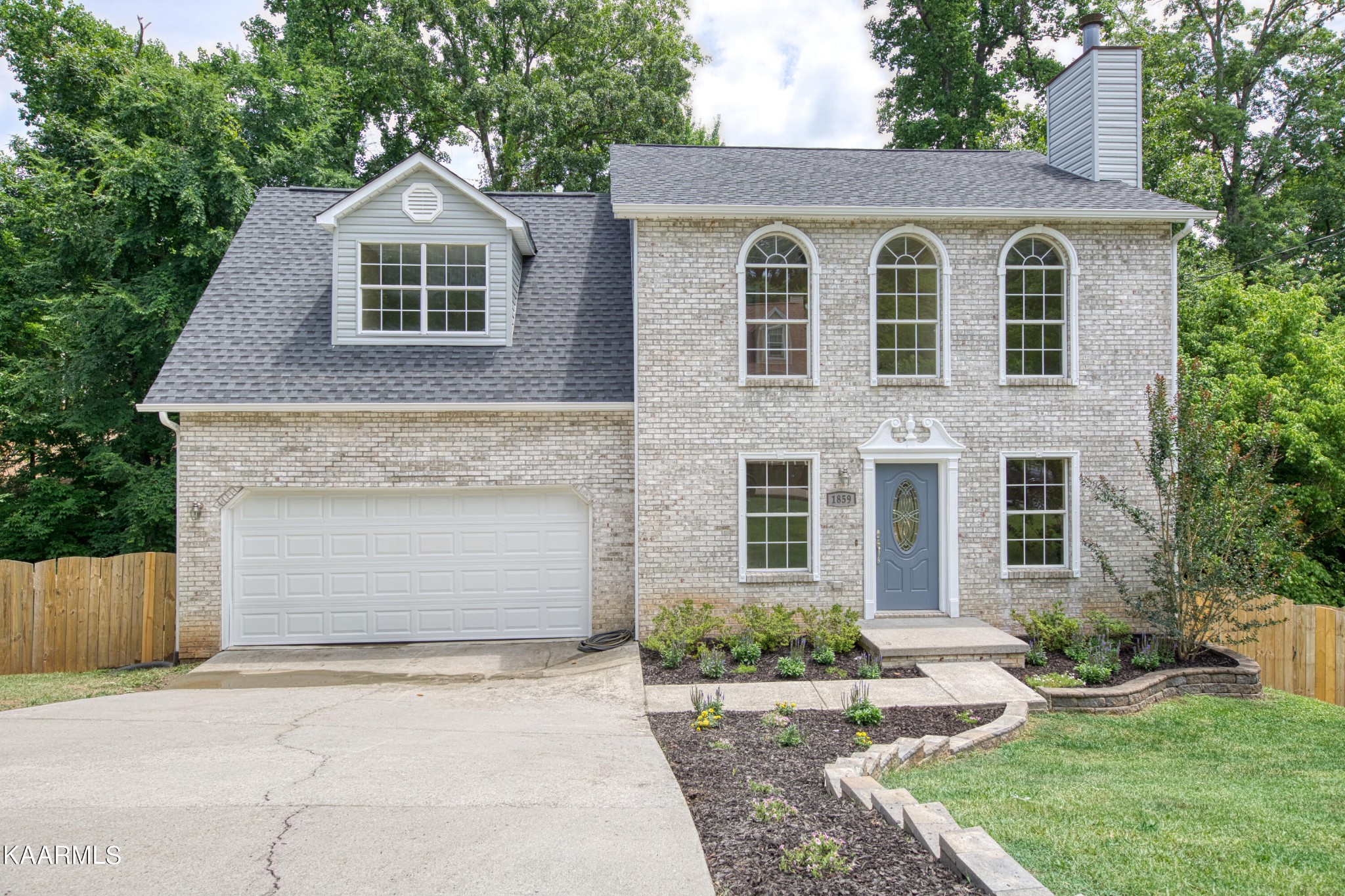 1859 Poplar Hill Road Knoxville, TN 37922 - Photo 38 of 39 a front view of a house with a yard and garage