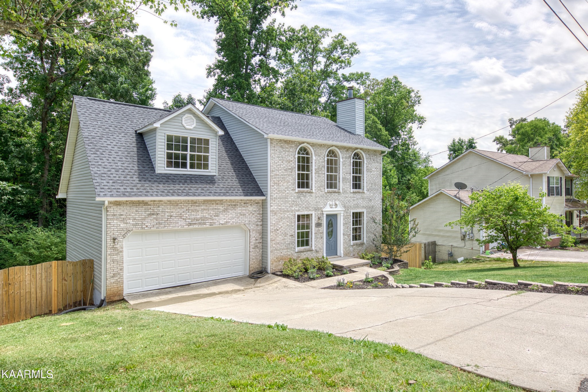 1859 Poplar Hill Road Knoxville, TN 37922 - Photo 39 of 39 a front view of a house with a yard and garage