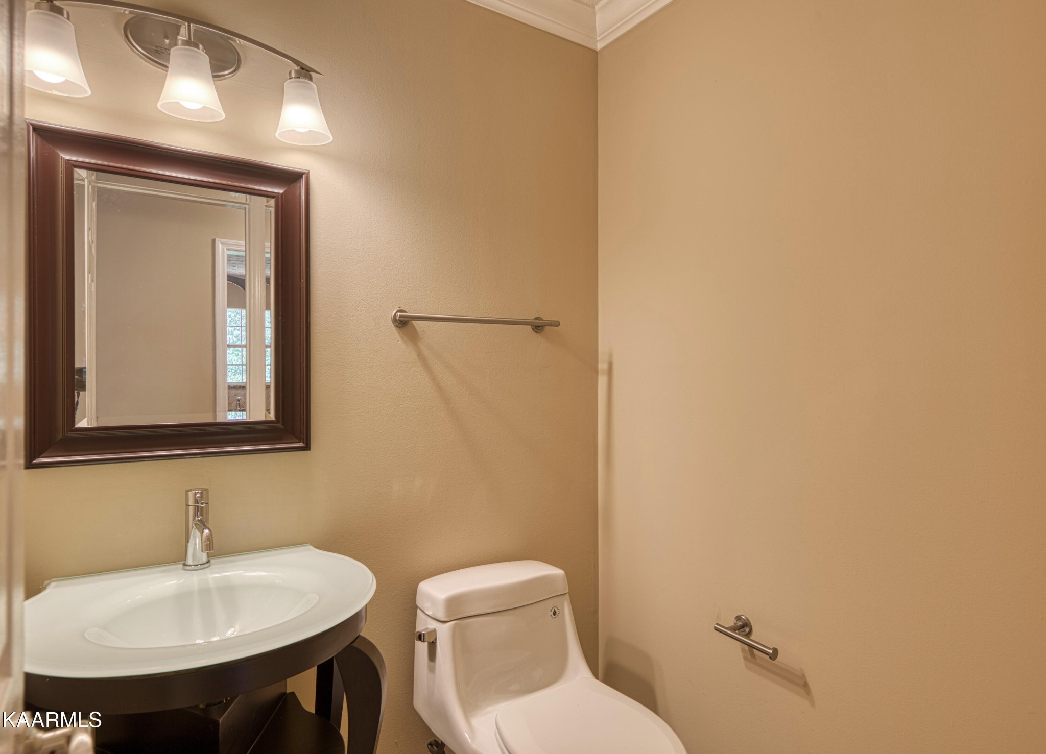 1859 Poplar Hill Road Knoxville, TN 37922 - Photo 6 of 39 a bathroom with a toilet a sink and mirror