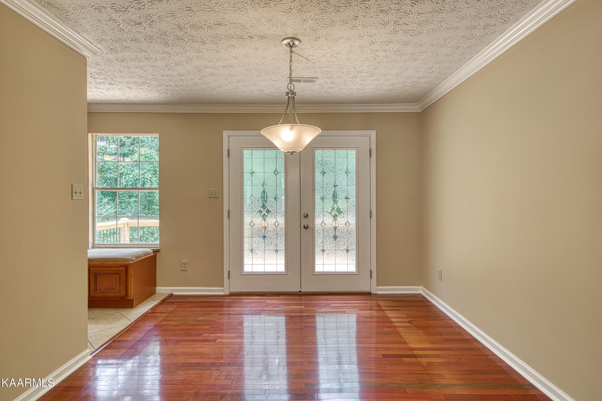 1859 Poplar Hill Road Knoxville, TN 37922 - Photo 8 of 39 a view of an empty room with a window and wooden floor