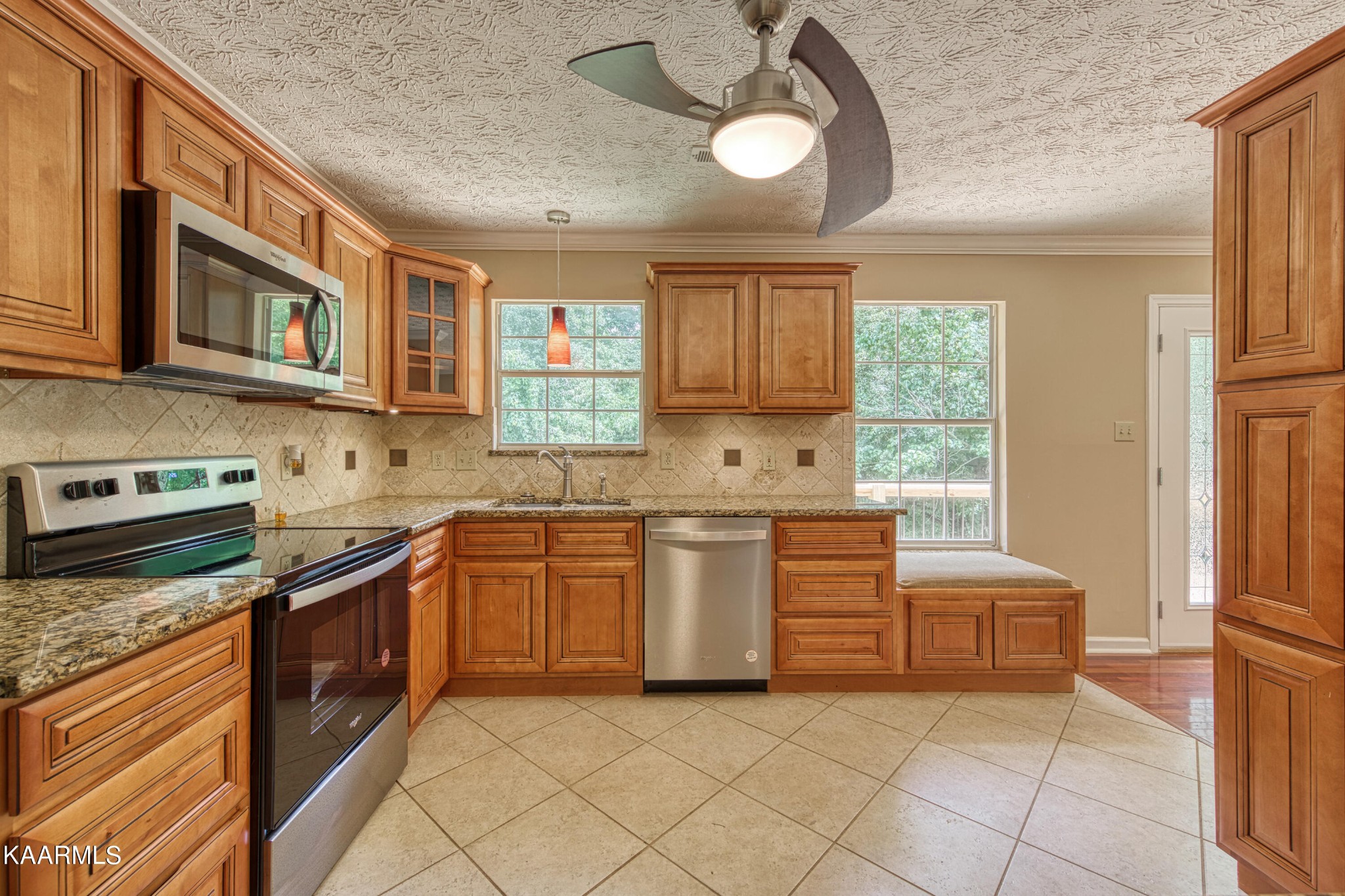 1859 Poplar Hill Road Knoxville, TN 37922 - Photo 9 of 39 a kitchen with stainless steel appliances granite countertop a stove and more cabinets