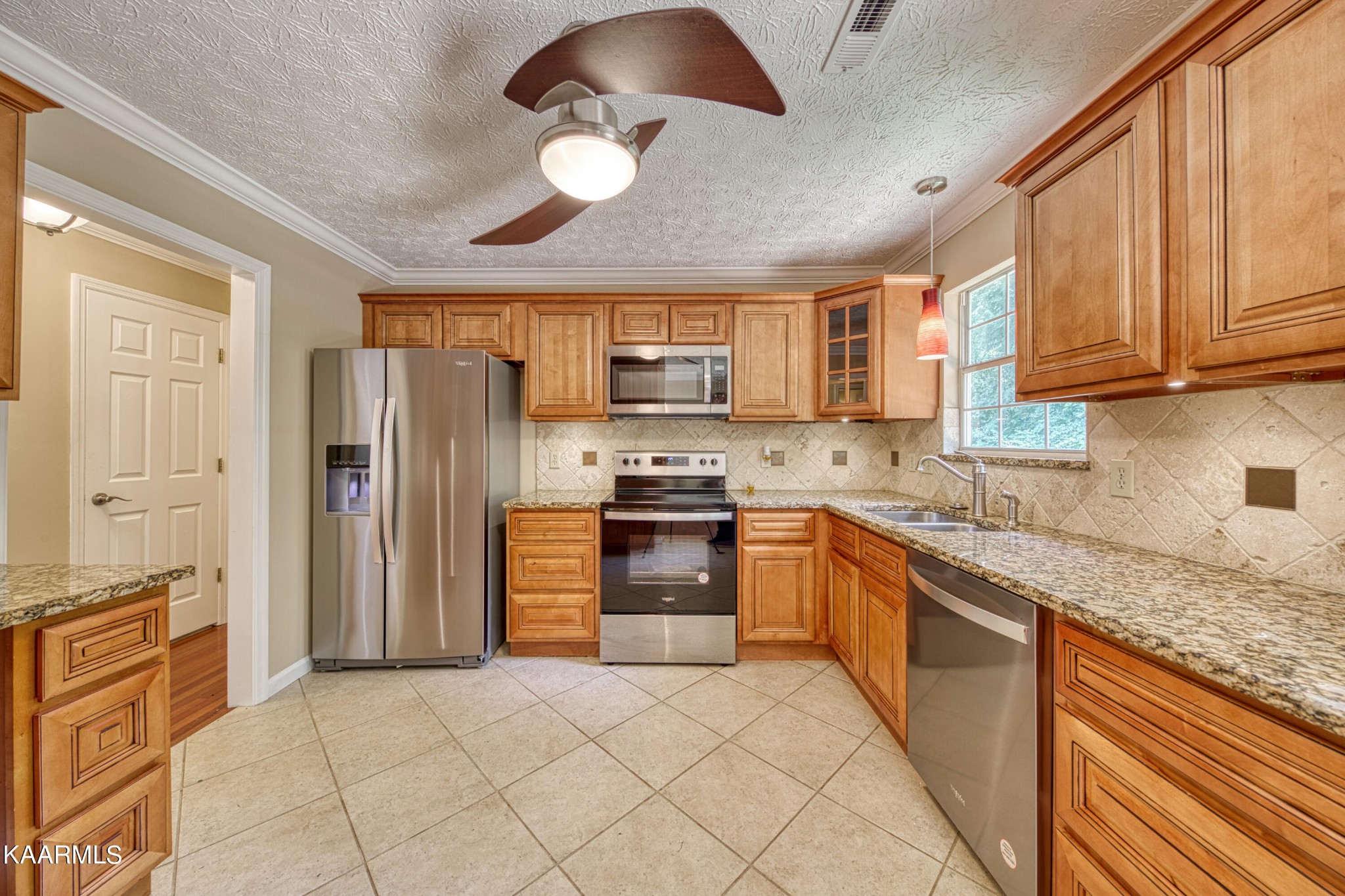 1859 Poplar Hill Road Knoxville, TN 37922 - Photo 10 of 39 a kitchen with stainless steel appliances granite countertop a refrigerator oven a sink dishwasher and granite countertops