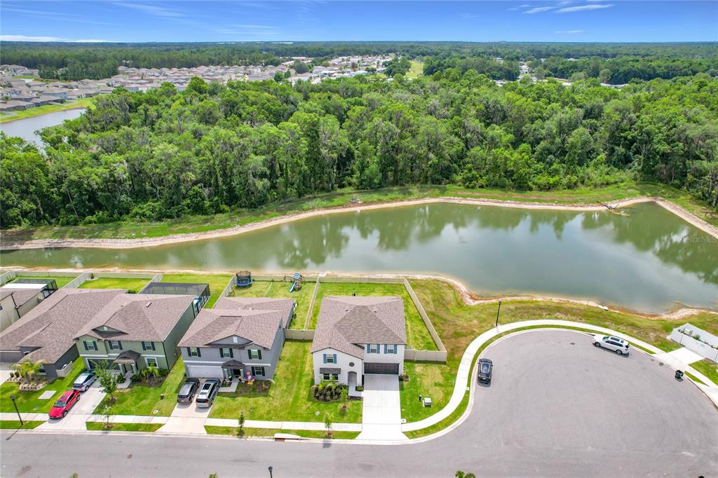1633 Red Loop Lakeland, FL 33801 - Photo 55 of 60 an aerial view of a house with a swimming pool