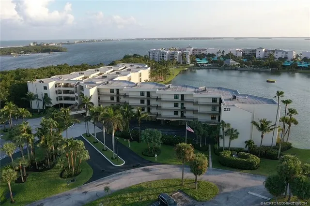 a view of a dining room with furniture and a chandelier