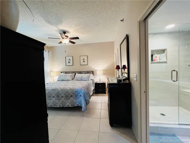 a kitchen with stainless steel appliances kitchen island granite countertop a sink and a stove top oven