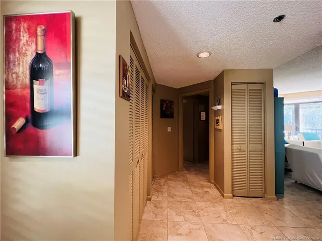 a view of swimming pool with outdoor seating and hardwood