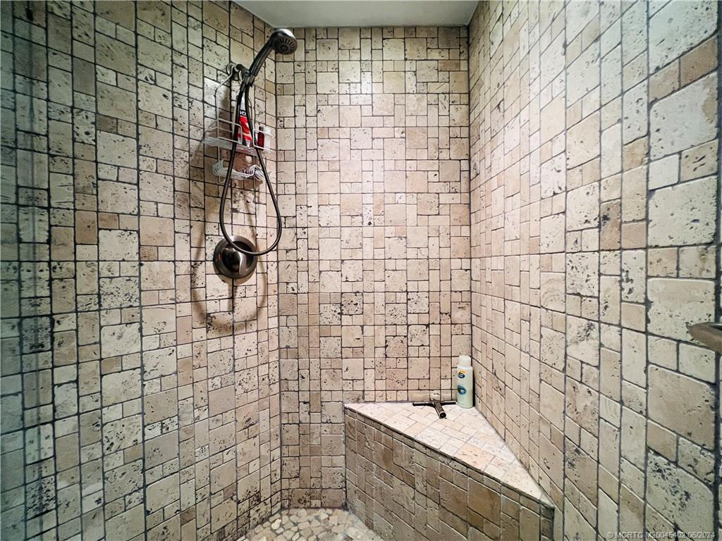 221 Northeast Plantation Road, Unit 215 Stuart, FL 34996 - Photo 62 of 83 a bathroom with a shower