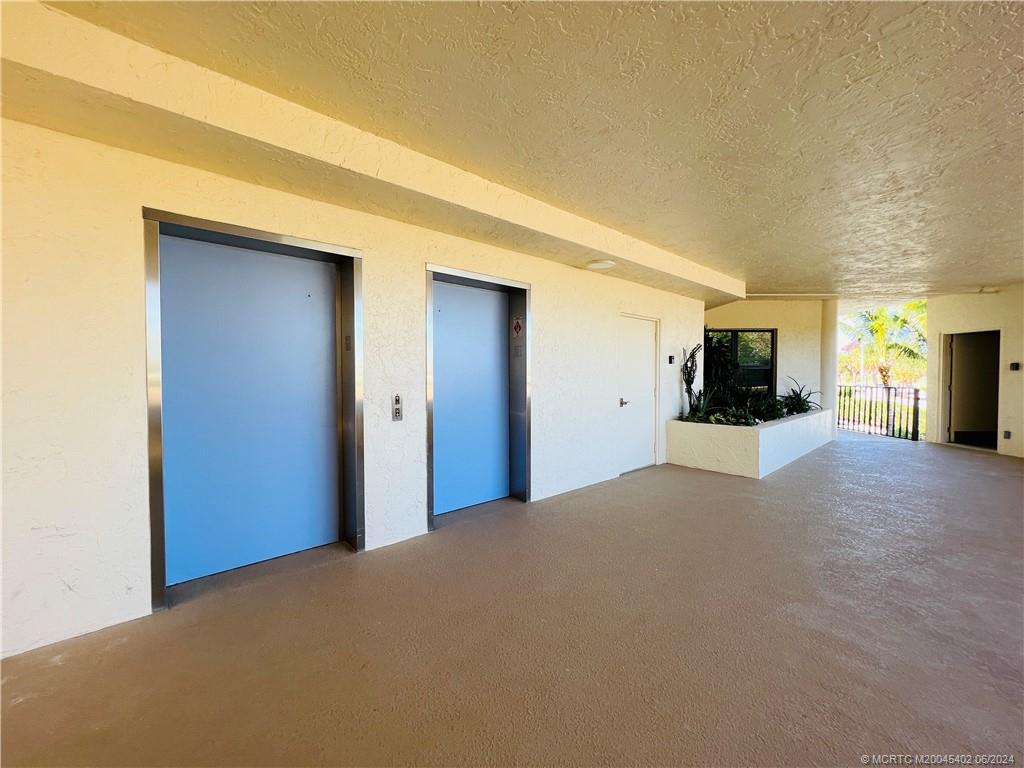 221 Northeast Plantation Road, Unit 215 Stuart, FL 34996 - Photo 63 of 83 a view of a livingroom with wooden floor and furniture