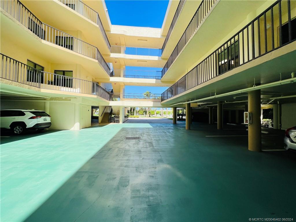 221 Northeast Plantation Road, Unit 215 Stuart, FL 34996 - Photo 65 of 83 a view of a building with a garden