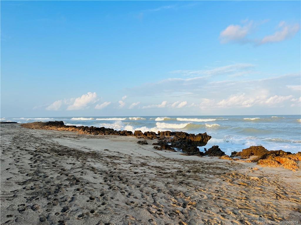 221 Northeast Plantation Road, Unit 215 Stuart, FL 34996 - Photo 80 of 83 a view of a lake with beach