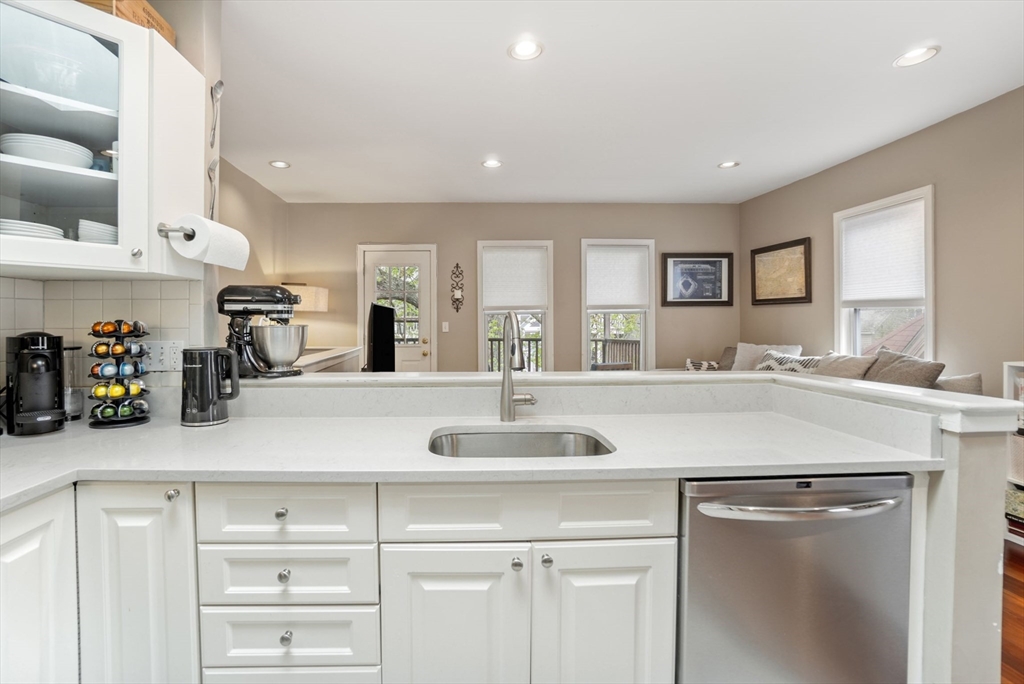 31 Regent Street, Unit 3R Cambridge, MA 02140 - Photo 11 of 28 a kitchen with cabinets appliances and a counter top space