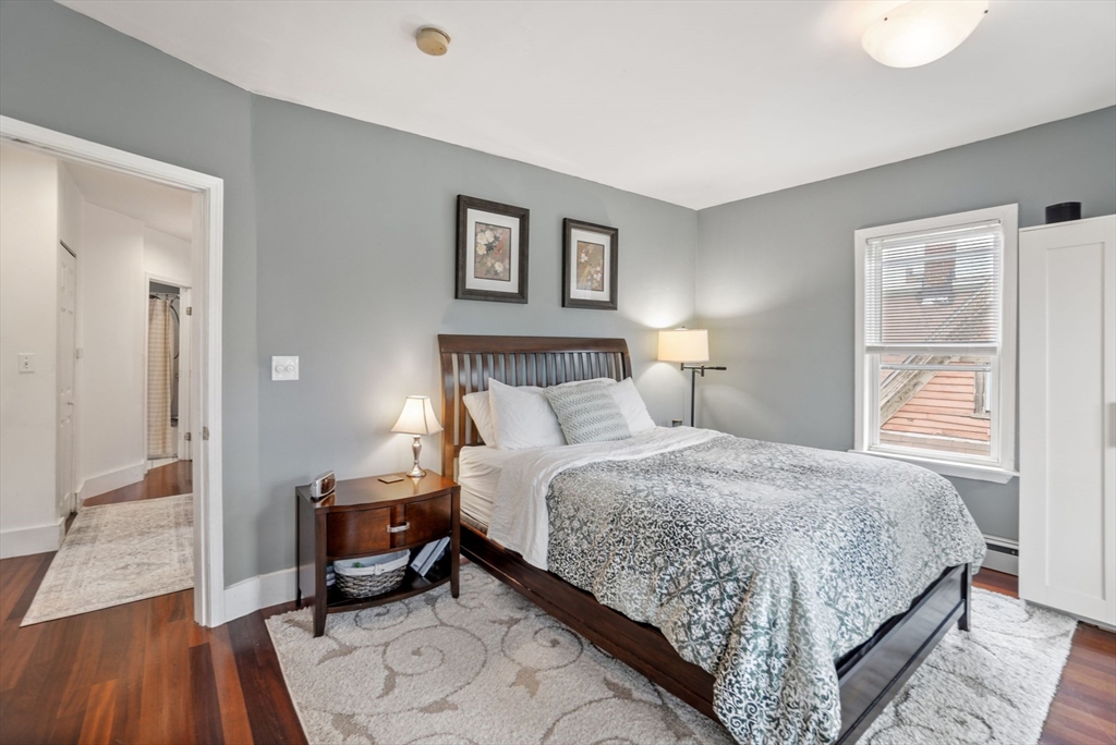 31 Regent Street, Unit 3R Cambridge, MA 02140 - Photo 13 of 28 a bedroom with a bed and a night stand