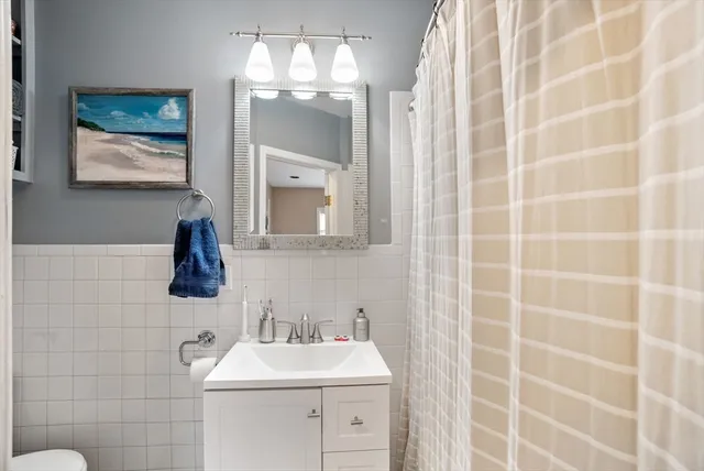a bathroom with a sink a vanity and a mirror