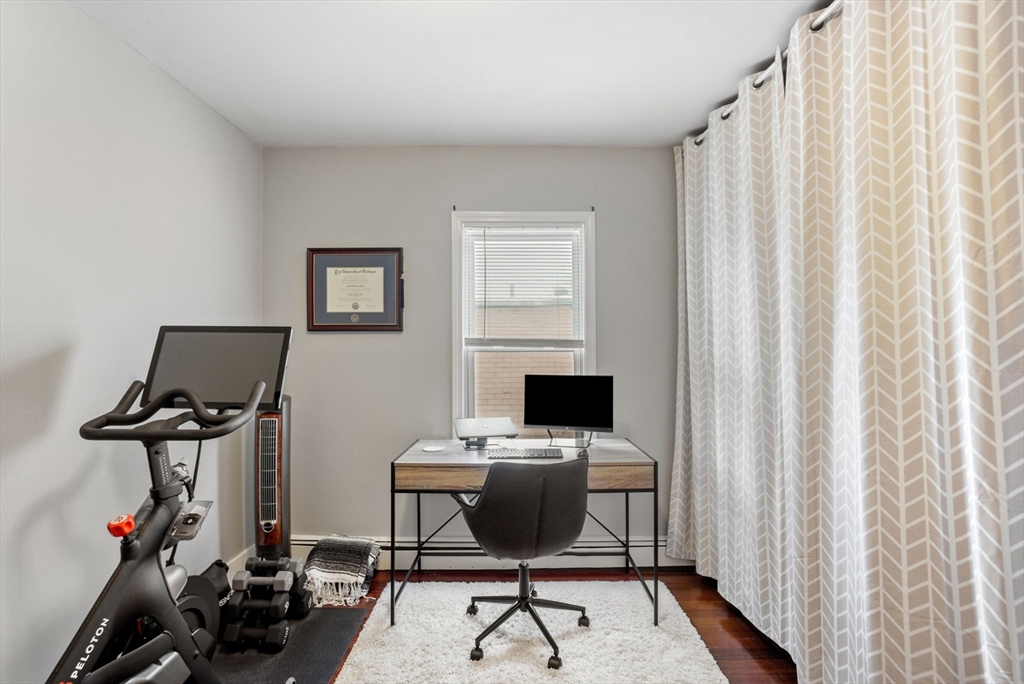 31 Regent Street, Unit 3R Cambridge, MA 02140 - Photo 20 of 28 a view of a workspace with furniture and a window