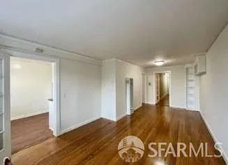 a view of a big room with wooden floor and closet
