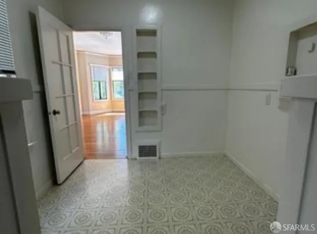 a bathroom with a sink and vanity