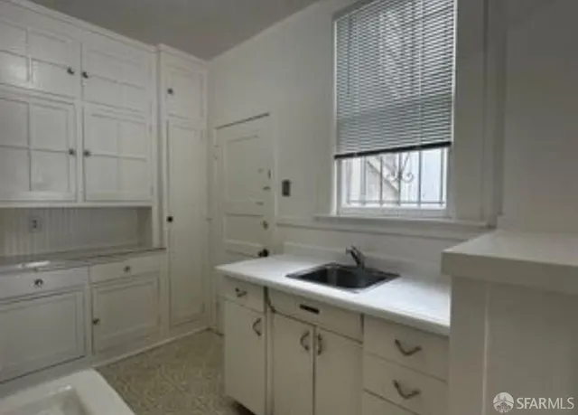 a bathroom with a bathtub and a sink