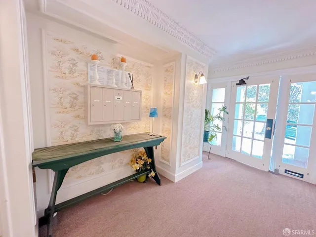 a spacious bedroom with a bed and a table in it