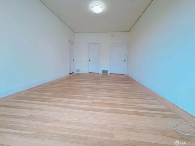 a kitchen with cabinets and appliances