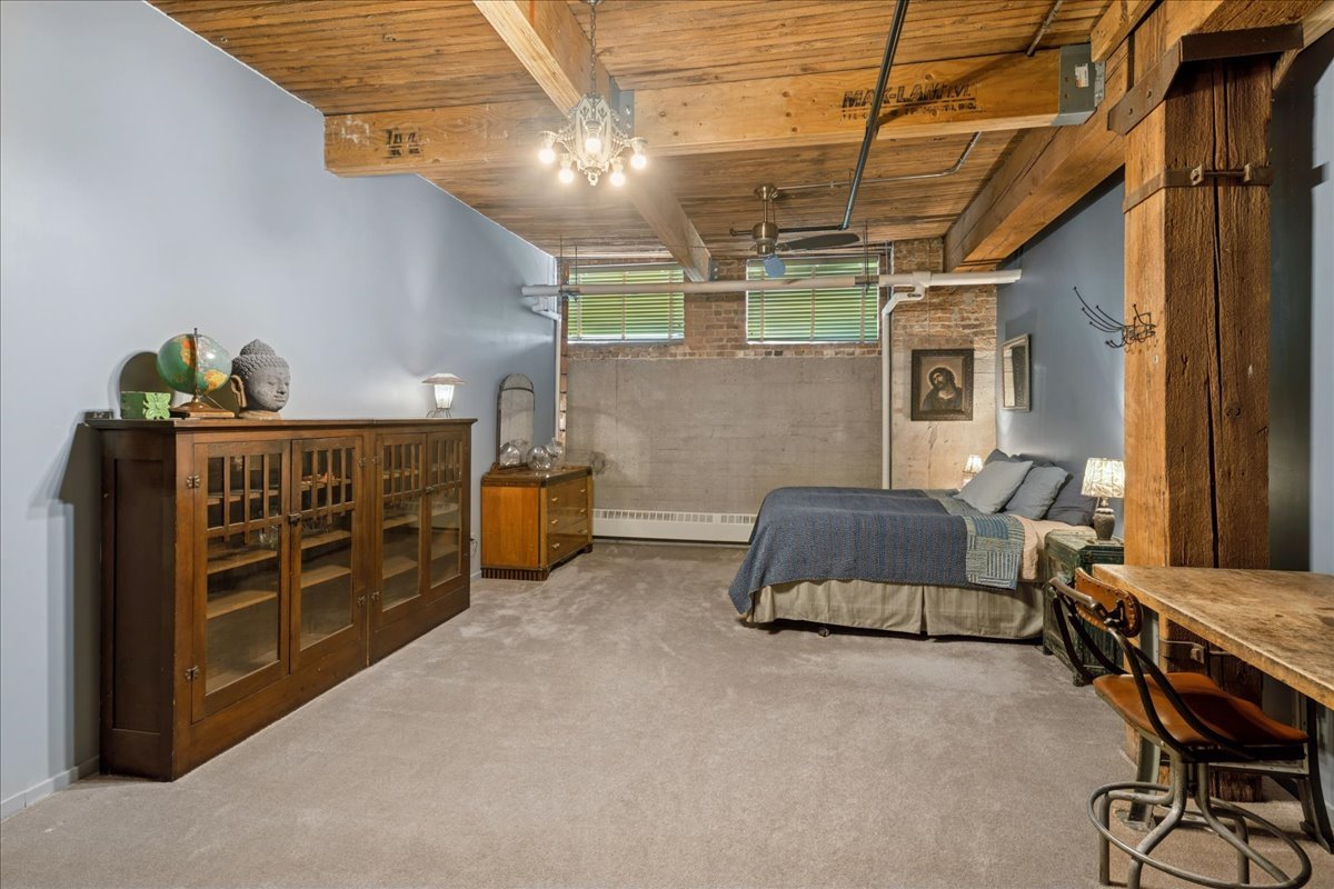 3500 South Sangamon Street, Unit 109 Chicago, IL 60609 - Photo 15 of 23 a bedroom with furniture and a window