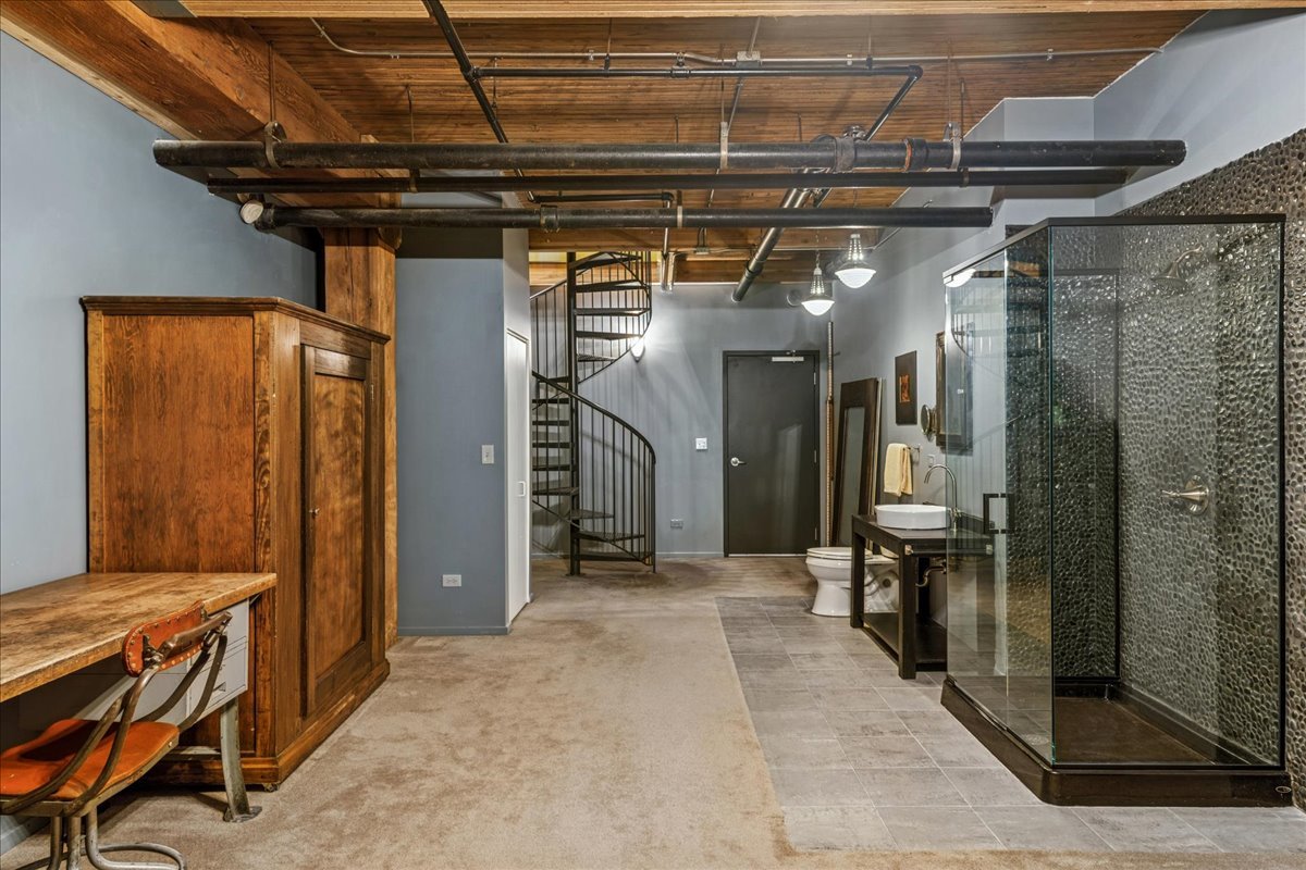 3500 South Sangamon Street, Unit 109 Chicago, IL 60609 - Photo 17 of 23 a view of a hallway with wooden walls