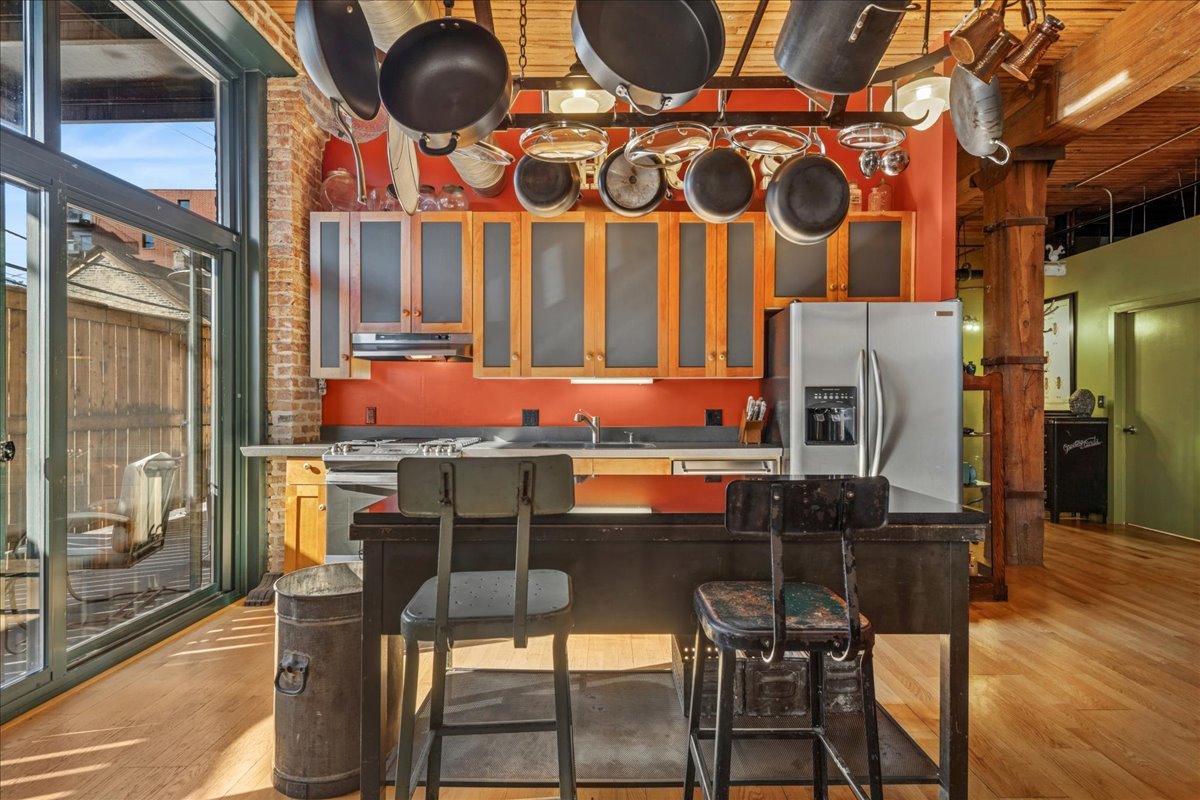 3500 South Sangamon Street, Unit 109 Chicago, IL 60609 - Photo 3 of 23 a kitchen with stainless steel appliances granite countertop a stove and a refrigerator