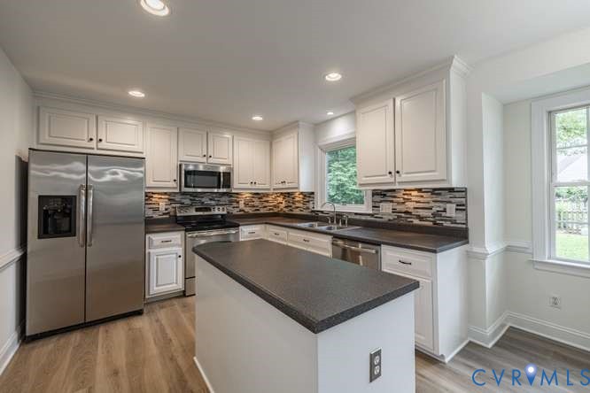 6118 Springwood Road Chester, VA 23831 - Photo 13 of 38 Kitchen featuring a central island, white cabinetr