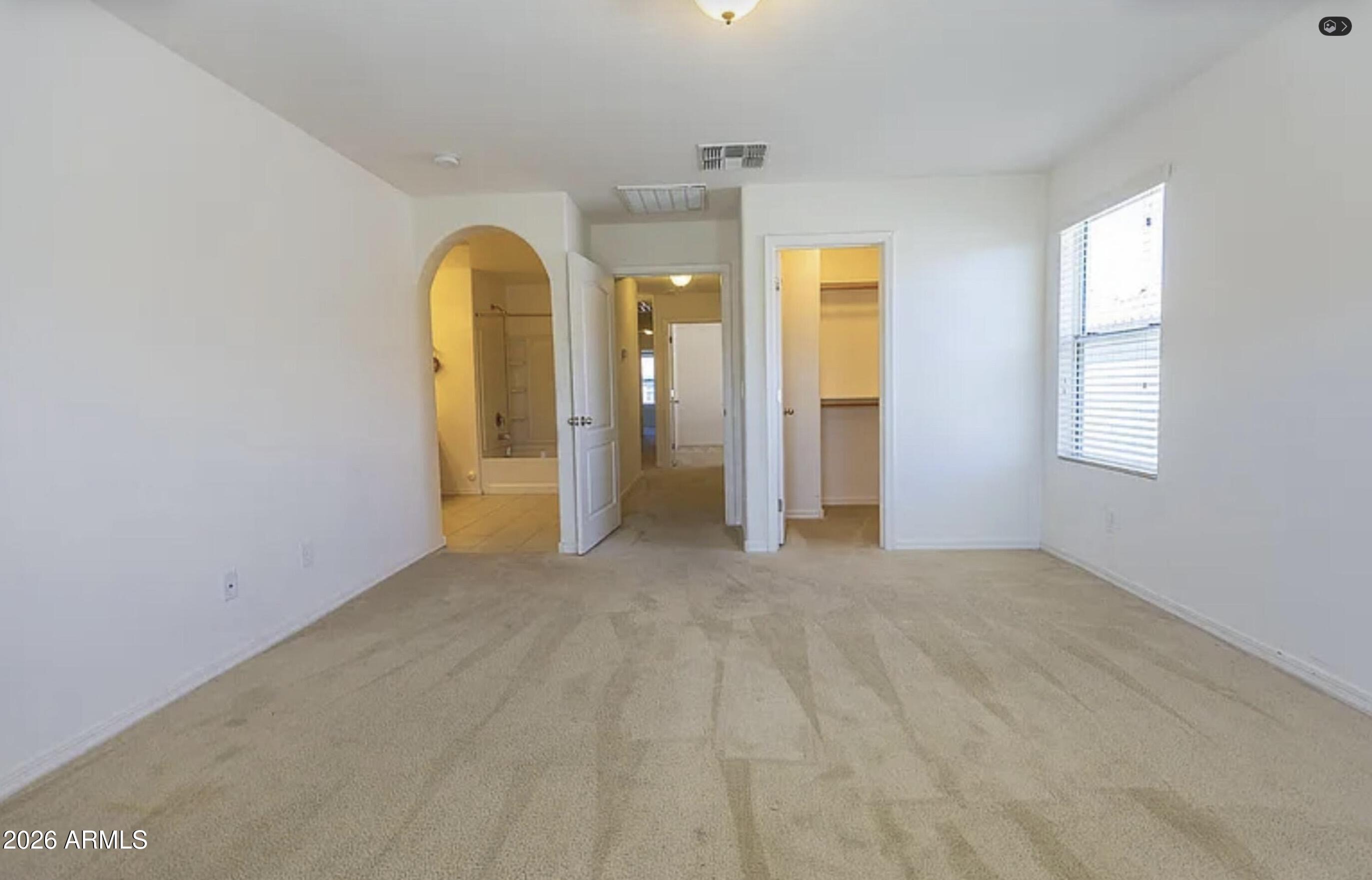 3701 East Hans Drive Gilbert, AZ 85296 - Photo 11 of 12 a view of an empty room with window and bathroom