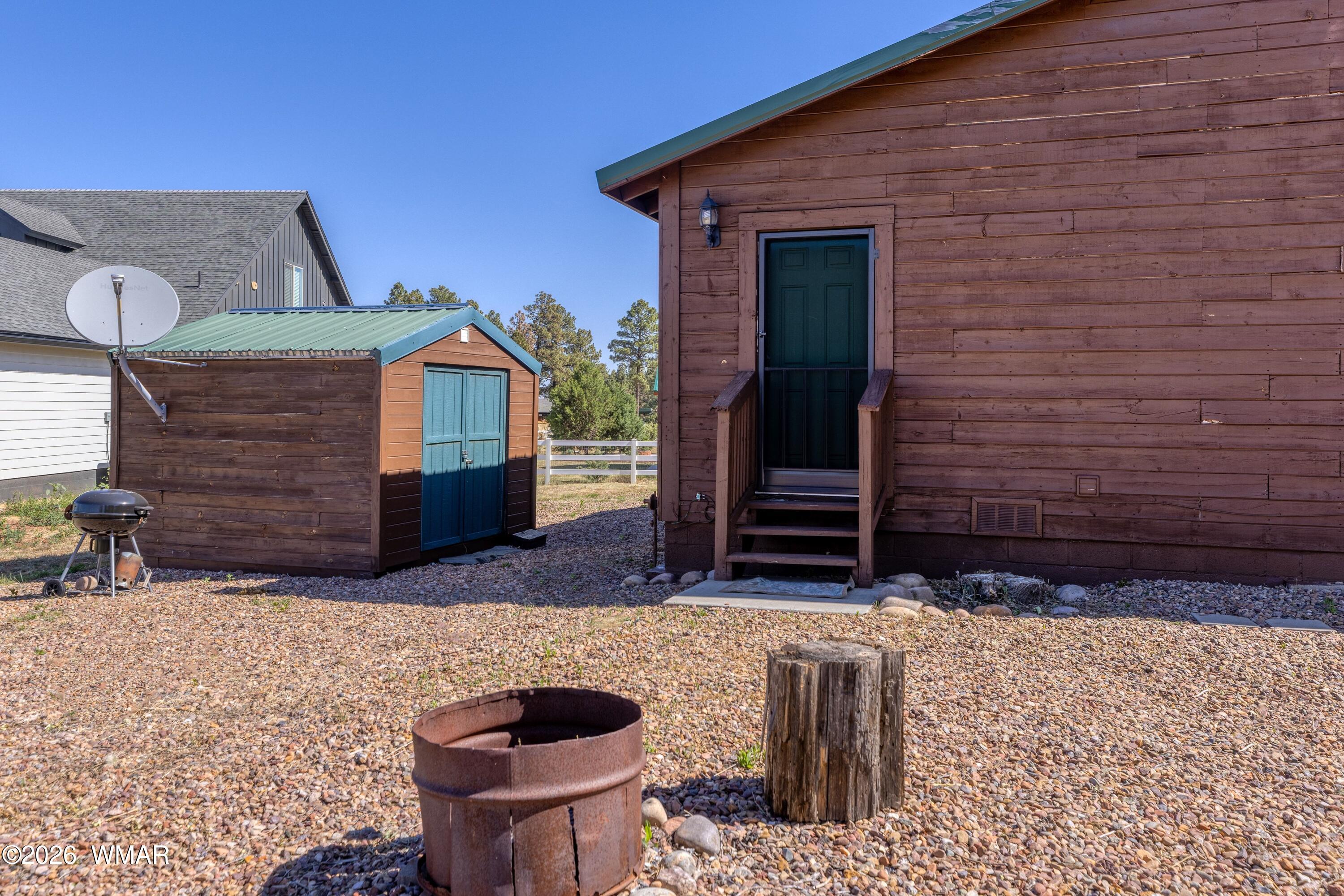 2722 Bain Trail Overgaard, AZ 85933 - Photo 22 of 28 a front view of a house with chairs