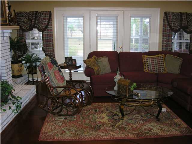 2594 Cove Road Navarre, FL 32566 - Photo 4 of 18 a living room with furniture and a window