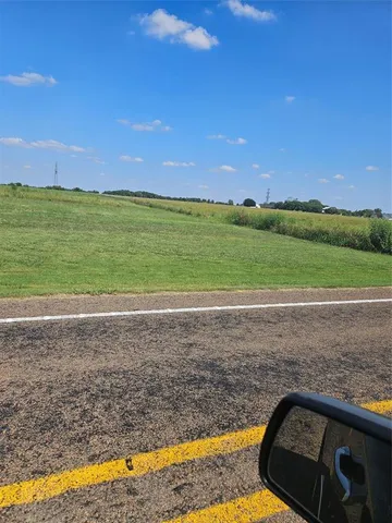 a view of a yard and ocean view