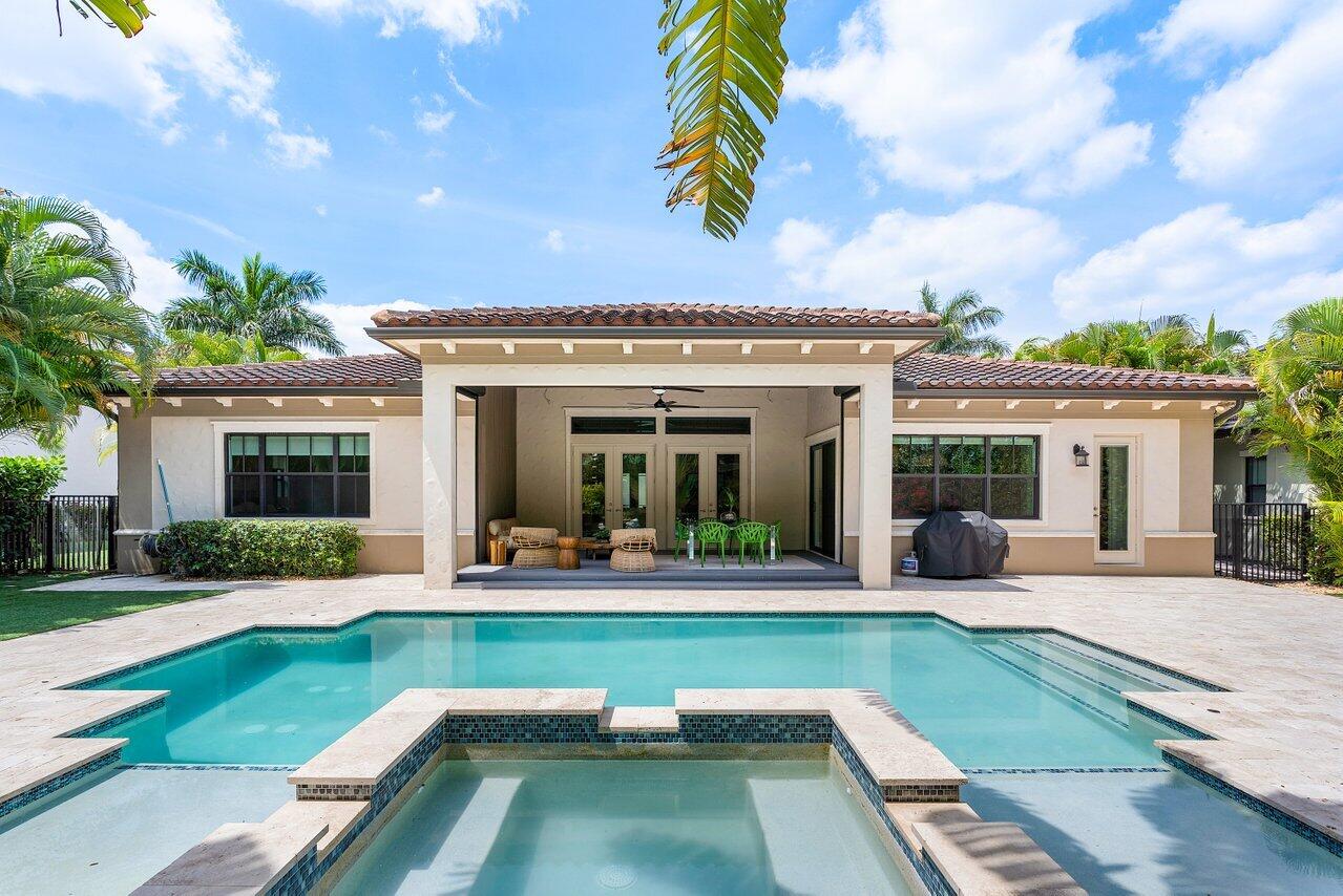 17662 Cadena Drive Boca Raton, FL 33496 - Photo 13 of 71 a view of a house with swimming pool and a yard