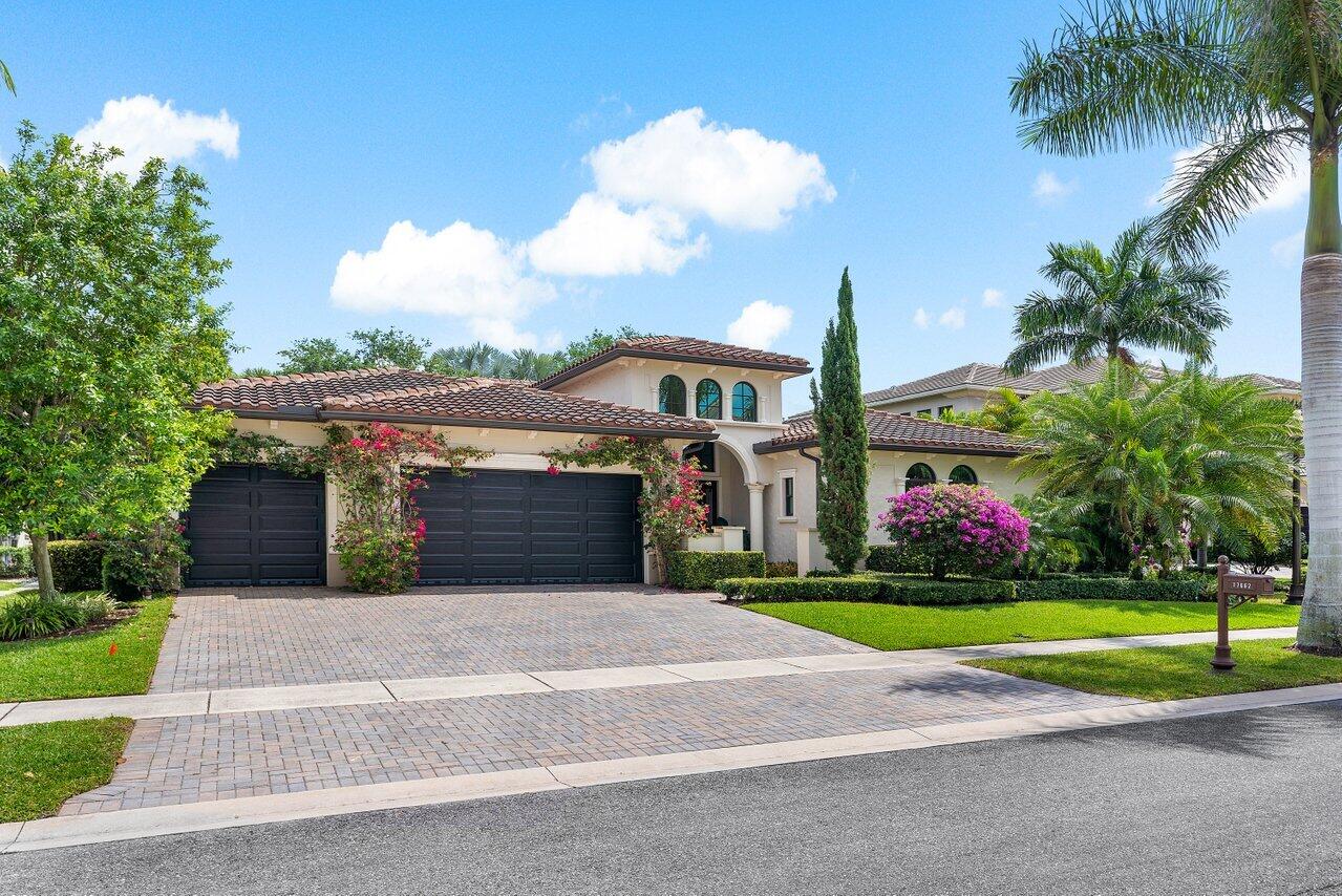 17662 Cadena Drive Boca Raton, FL 33496 - Photo 24 of 71 a front view of house with yard and green space