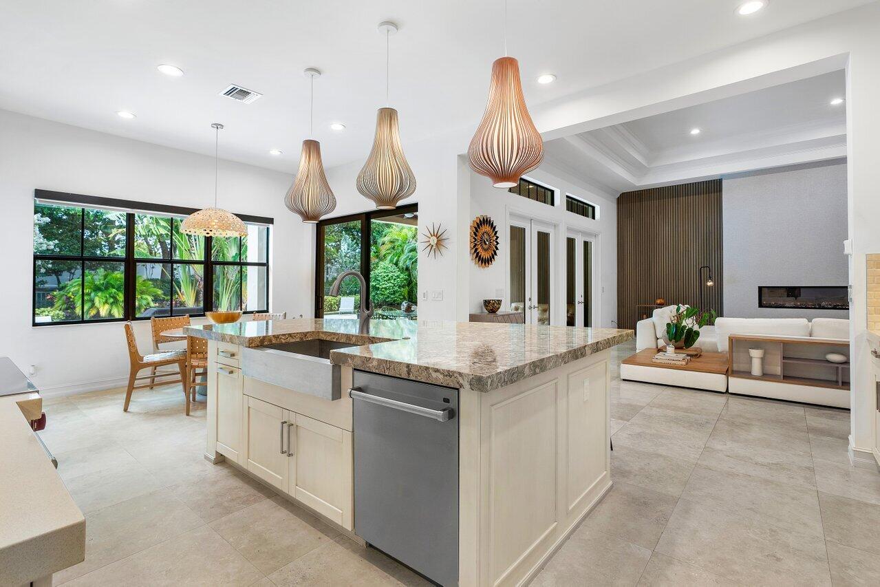 17662 Cadena Drive Boca Raton, FL 33496 - Photo 30 of 71 a kitchen with stainless steel appliances granite countertop a stove and a sink
