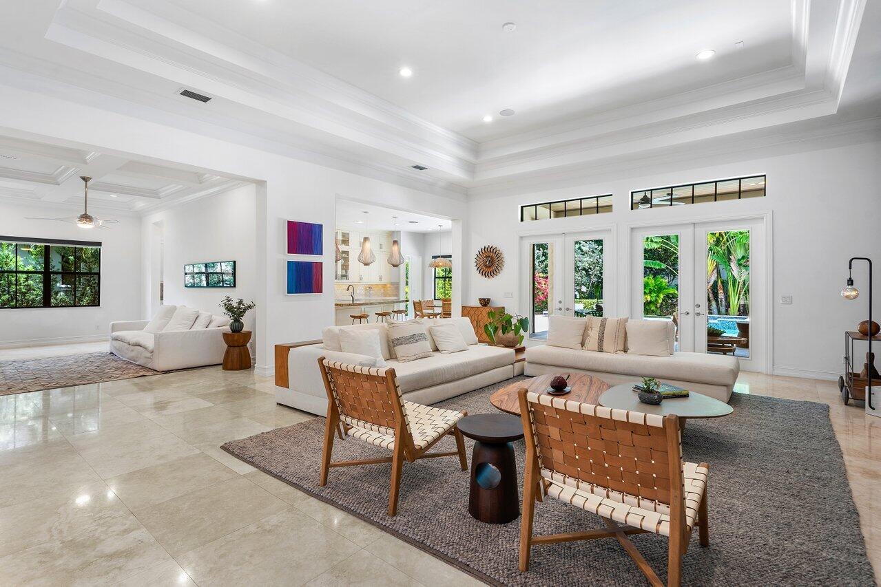 17662 Cadena Drive Boca Raton, FL 33496 - Photo 3 of 71 a living room with furniture a table and a large window