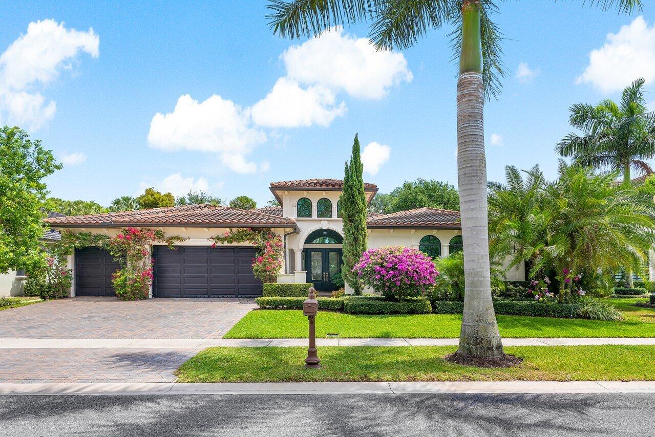 17662 Cadena Drive Boca Raton, FL 33496 - Photo 36 of 71 a front view of multi story residential apartment building with yard and green space