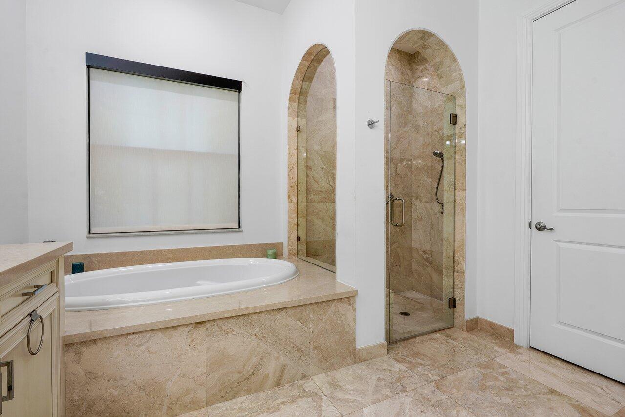 17662 Cadena Drive Boca Raton, FL 33496 - Photo 42 of 71 a bathroom with a granite countertop sink and a shower
