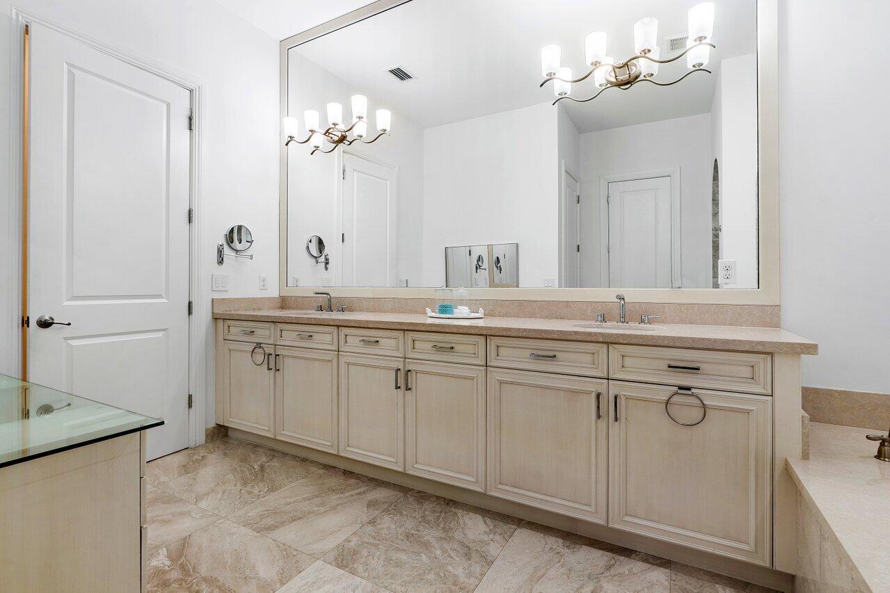 17662 Cadena Drive Boca Raton, FL 33496 - Photo 43 of 71 a bathroom with a sink and a mirror