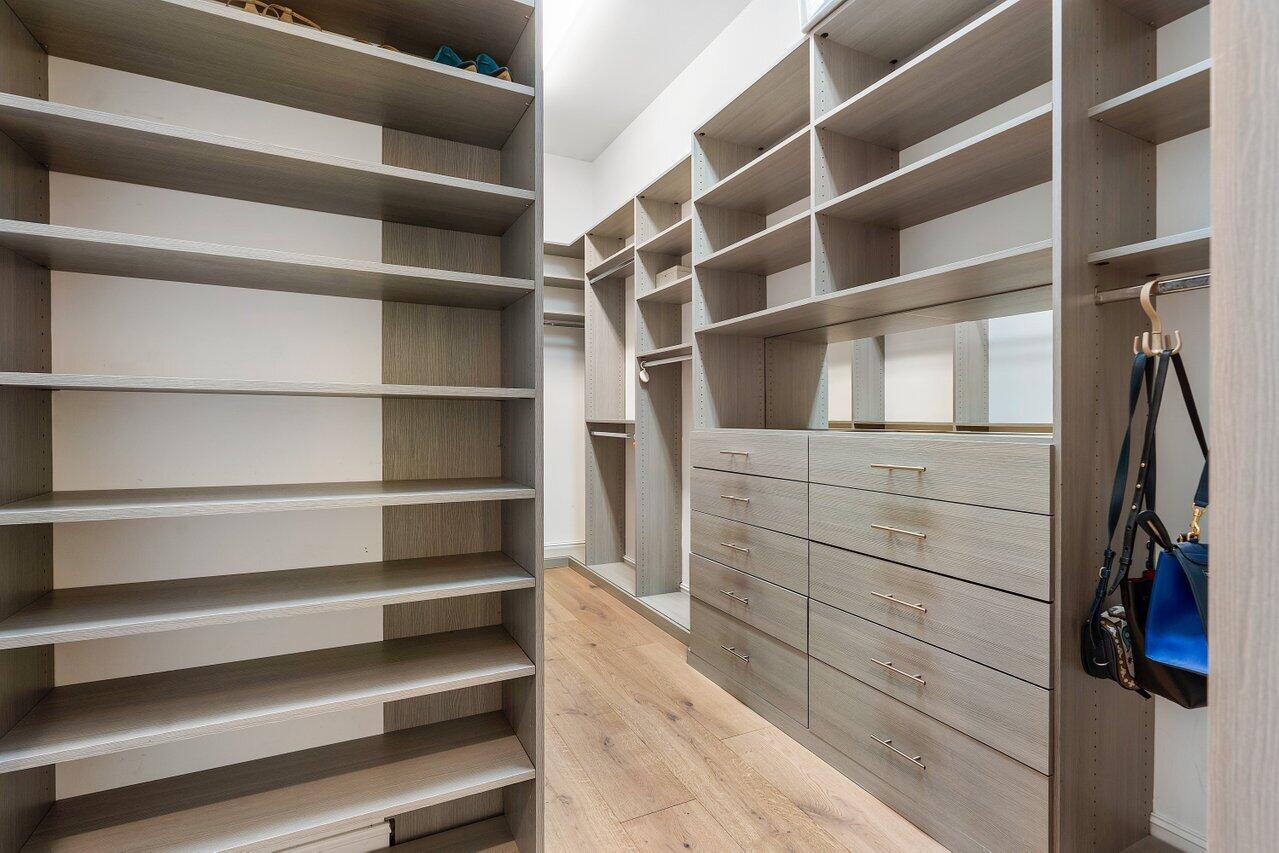 17662 Cadena Drive Boca Raton, FL 33496 - Photo 44 of 71 a view of walk in closet with empty racks