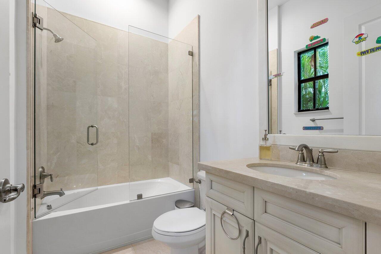 17662 Cadena Drive Boca Raton, FL 33496 - Photo 46 of 71 a bathroom with a sink a toilet and shower
