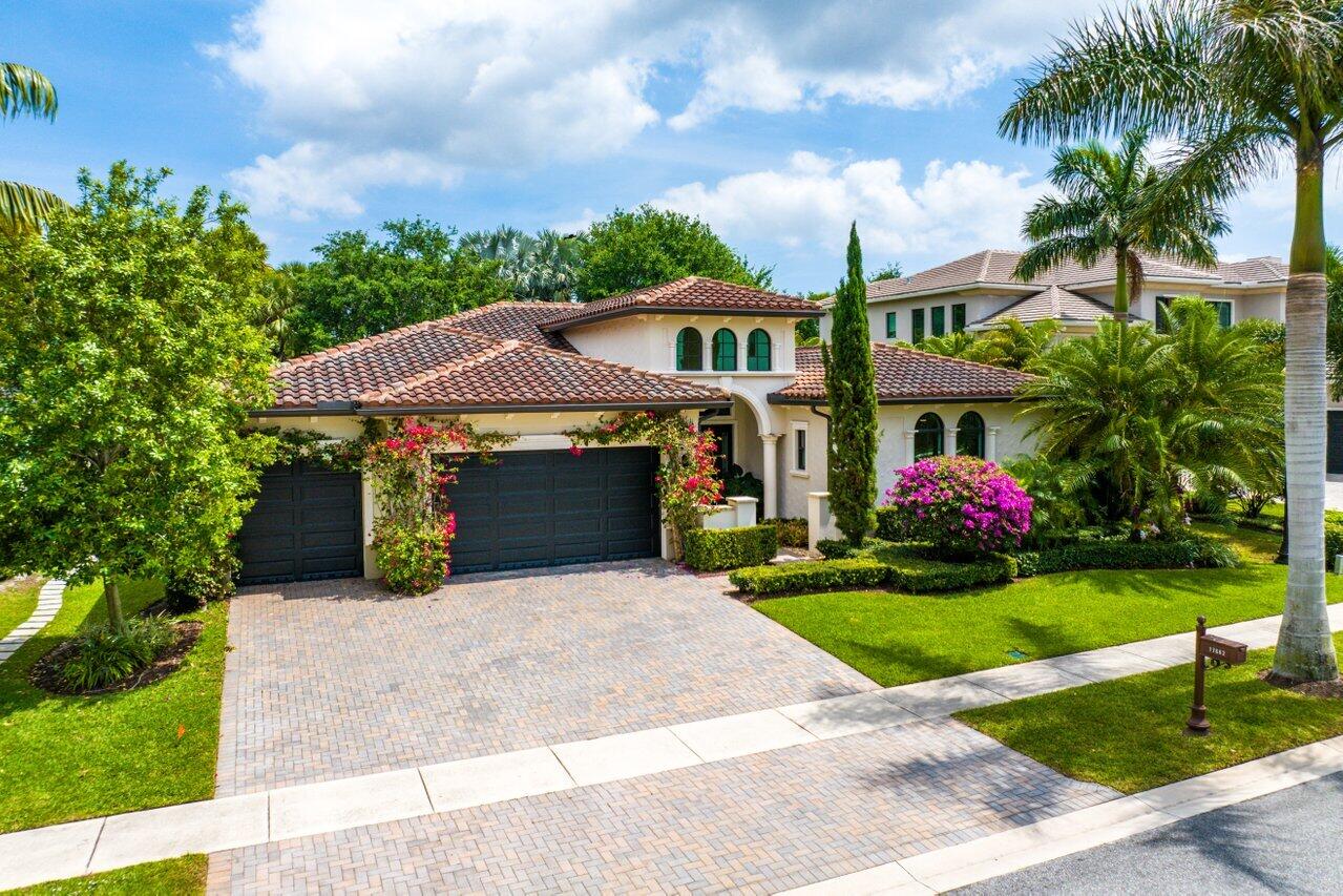 17662 Cadena Drive Boca Raton, FL 33496 - Photo 53 of 71 a front view of house with yard and green space