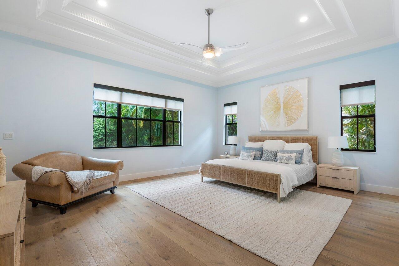 17662 Cadena Drive Boca Raton, FL 33496 - Photo 9 of 71 a spacious bedroom with a bed and a couch