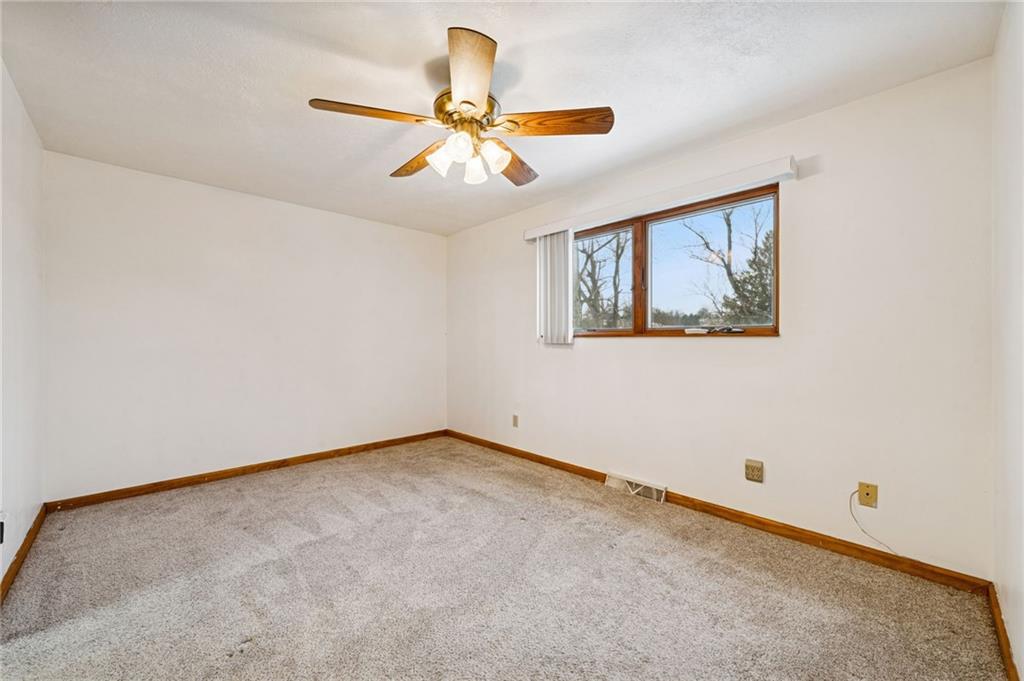 910 Colonial Manor Road Irwin, PA 15642 - Photo 18 of 40 a view of an empty room with a window
