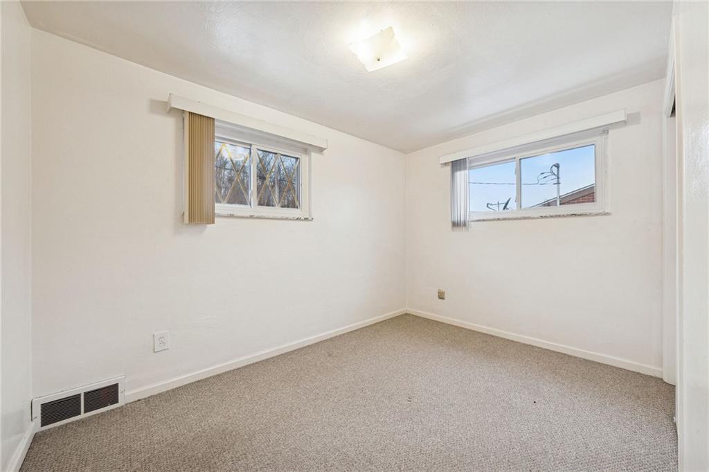 910 Colonial Manor Road Irwin, PA 15642 - Photo 22 of 40 an empty room with a window